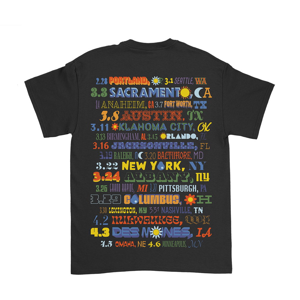 Black t-shirt with colorful text listing various cities and dates.