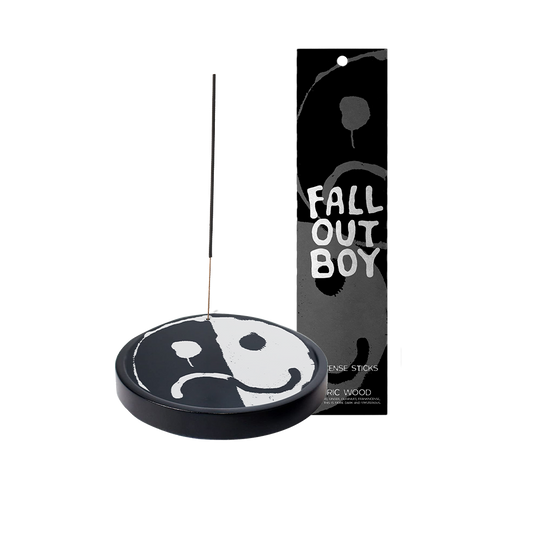 Yin-yang shaped incense holder with ’Fall Out Boy’ packaging.