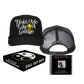 Black trucker hat with white text ’Hold Me Like A Grudge’ and a yellow star emblem.