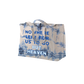 Tie-dyed canvas tote bag with blue text reading ’NOWHERE LEFT FOR US TO GO BUT HEAVEN’.
